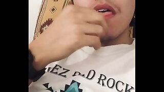 American Indian Boy fooling around while is jerking in living room